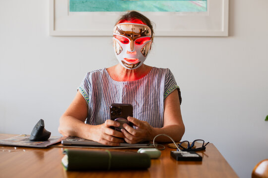 woman with red light mask