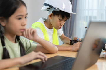Kids boy and girl working together on robotics project, combining programming, engineering skills, promoting STEM education, teamwork, creativity, learning for future innovation.