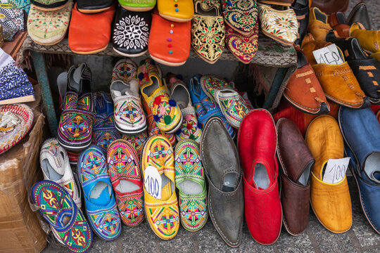 Colorful Moroccan slippers displayed on Tangier stall