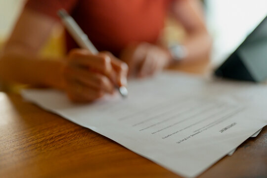 Person signing legal document or business contract
