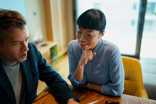 Diverse business colleagues discussing project ideas during office mee