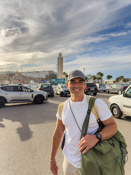 Man arriving in Tangier, Morocco looking at camera with backpacks