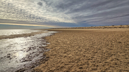 Lake Eyre dry salt flat landscape with cloudy sky