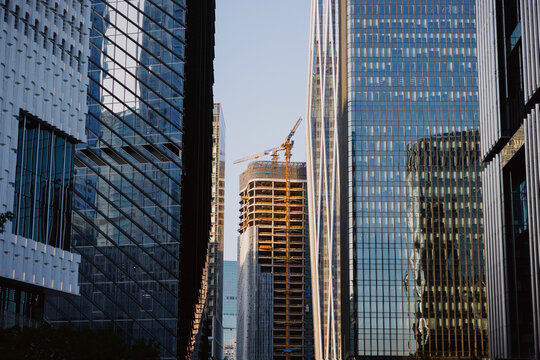 Modern Cityscape Featuring Construction at Sunset in an Urban Setting