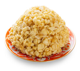 Tatarian delight Chak-chak on a plate isolated white background. A sample for design