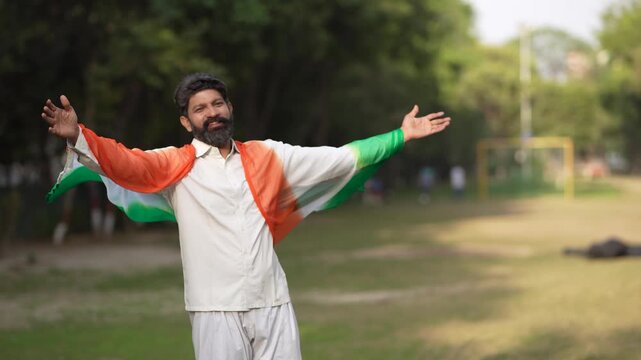 man waving indian tricolor flag while celebrating independence day or republic day 