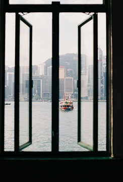 City skyline through open windows by the harbor
