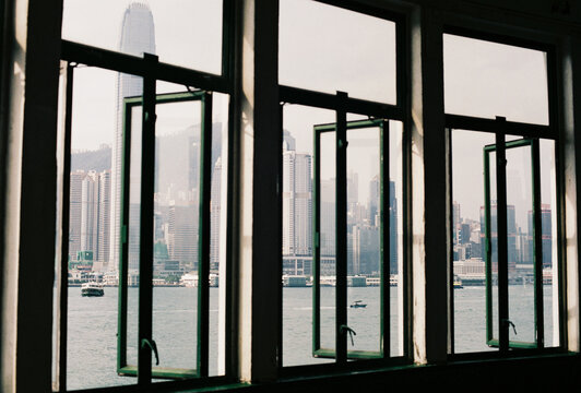 City skyline through open windows by the harbor
