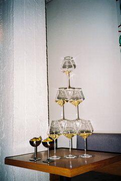 Champagne glass pyramid on modern table
