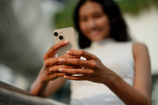 Woman Holding Smartphone Outdoors 