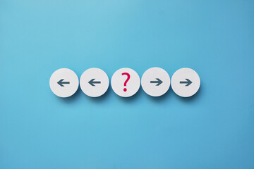 Left and Right Arrows with Question Mark on Paper Circles, Choice Concept
