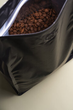 Coffee beans in opened black bag