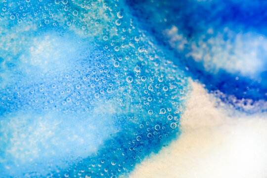 Close-up View of Blue Bubbly Surface in Bright Light