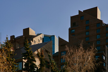 Layered Brick Architecture with Modern Tower in Calgary Downtown