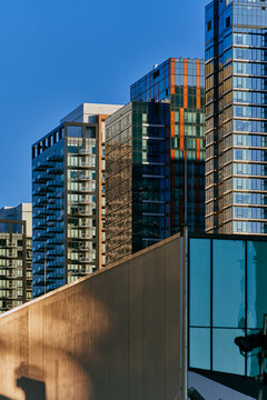 Abstract Reflections of City Buildings on Glass Facade