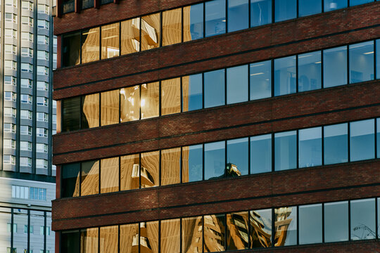 Abstract Reflections of City Buildings on Glass Facade