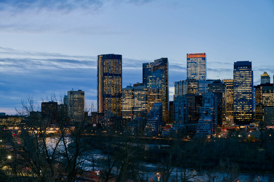 Blue Hour View of Calgary Downtown Skyline with River and Traffic Trai
