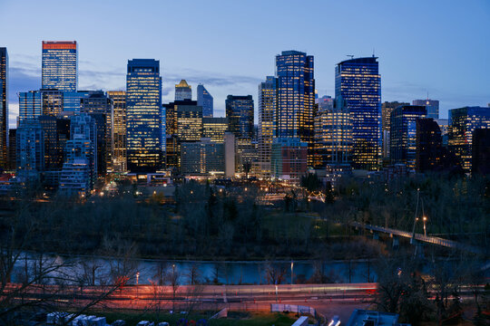 Blue Hour View of Calgary Downtown Skyline with River and Traffic Trai