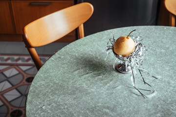 Golden pear centerpiece on a kitchen table