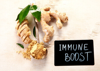 Fresh ginger with sliced and green leaves.