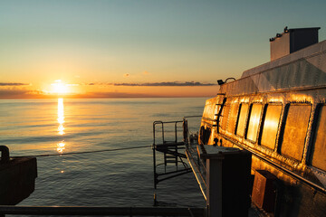 Sunrise Reflections on Ferry Deck