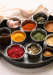 Different aromatic spices in bowls.