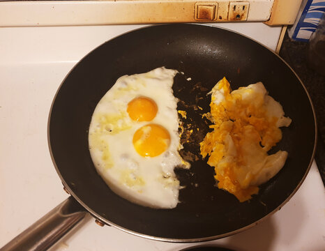 Sunny-side-up eggs facing scrambled eggs