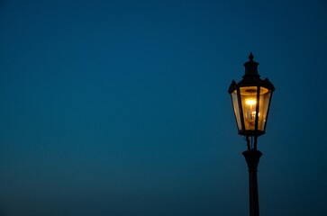 Czech Republic, Prague September 6, 2025,   a glowing lantern on the Charles Bridge in Prague