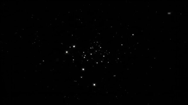 Abstract motion of glowing particles simulating stars or dust in space