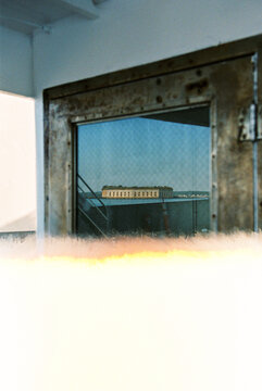 First frame on film roll of a reflection on a ferry boat window