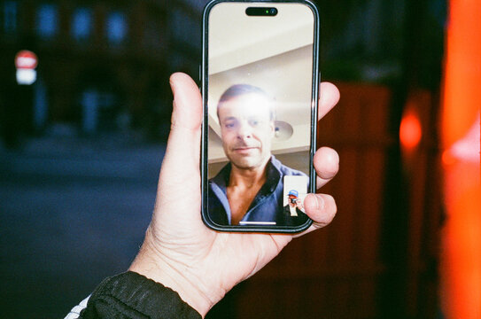 Man phone Video Call in the city at night