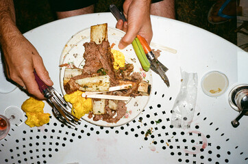 Anonymous Hand holding a dish after eating