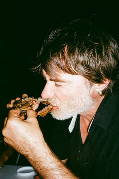 gnawing on a rib bone after the barbecue