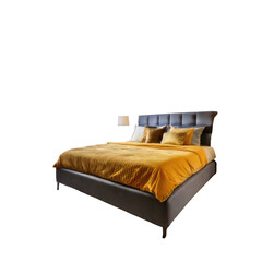 Cozy bed with pillows, quilt, & small bedside lamp