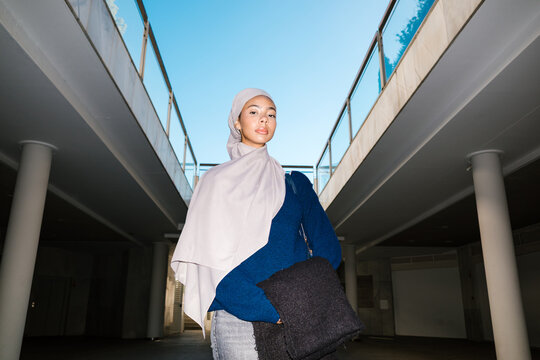 Young woman wearing  standing in urban setting