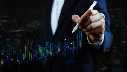 Businessman hand drawing glowing financial chart with rising bar graph and market data. Concept of investment growth, stock market analysis, trading strategy, financial success, and digital economy.