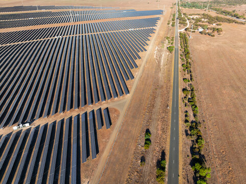 Rows of solar panels on dry rural land