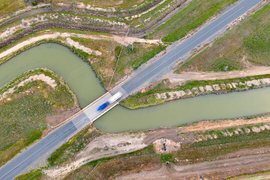 Traffic on a bridge over an irrigation channel