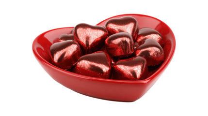 Bowl full of wrapped red heart shaped chocolates for valentines day holiday treat