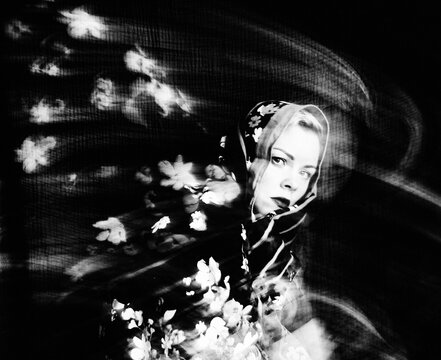 Elegant woman in floral scarf, B&W