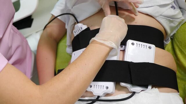 Lipo laser equipment on female body in medicine salon or modern beauty clinic. Body care. Fast fat burning. wellness center with weight loss procedures. 4 k video