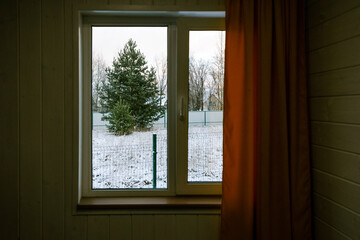 Winter scene view from a cozy room window