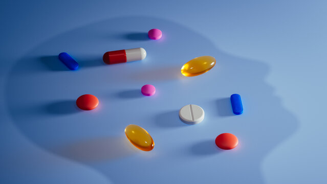 Silhouette of head with creatively arranged pills and supplements