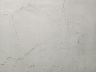 Detailed perspective of a distressed wall surface with a network of fine cracks and aged texture