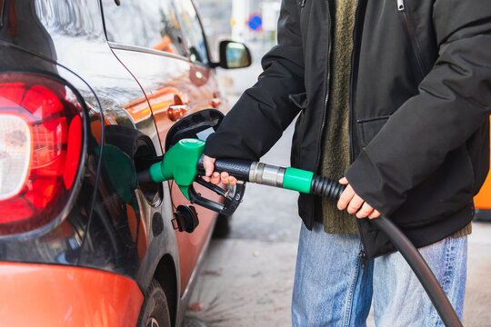 Person Refueling Car at Gas Station, Close-up
