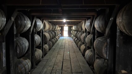 Barrels Of Whiskey Bourbon Aging And Maturing In A Cold Climate Basement Cellar In A Distillery.