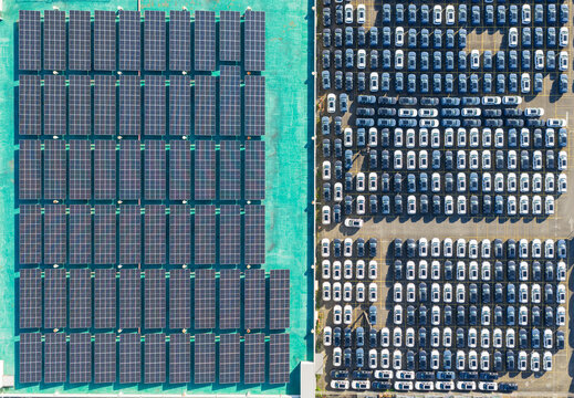 Aerial View of Solar Rooftop Beside Car Dealership Lot