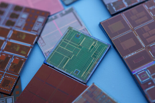 Microchips Arranged on a Blue Surface Showcasing Advanced Technology