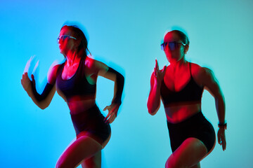 Dynamic runners in colorful lights during high-energy workout se