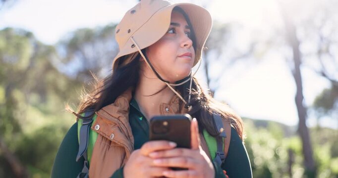 Woman, phone and hiking in woods, search and low angle for location, direction and confused on holiday. Person, smartphone and lost with mobile app, flare or scroll on map for trekking in forest
